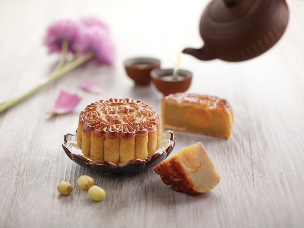 Smooth white lotus paste and egg yolk are enveloped in fragrant baked crust. Traditional mooncake for the festive!